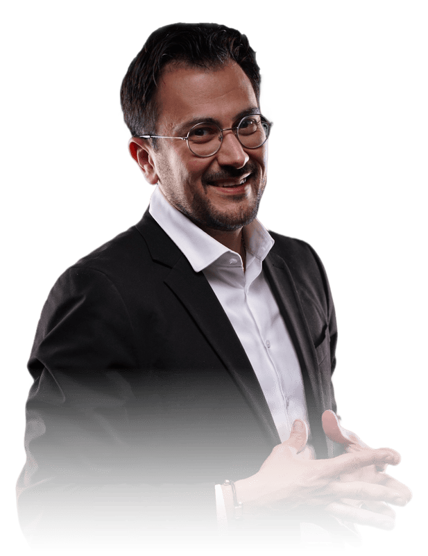 Dr. Gurgen Petrossian in a dark jacket, smiling warmly, explaining gesture